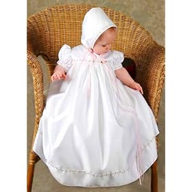 Mandi satin christening gown with pink trim.